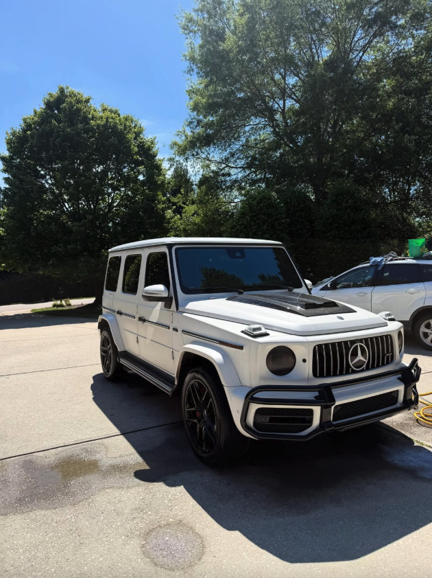 Mercedes G-Wagon white detailed under blue sky